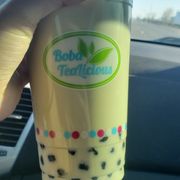 A honeydew milktea with boba