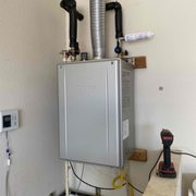 Tankless water heater we installed for this customer with a digital controller, service valves, and a scale shield filter.