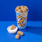 a cup of milk and some pretzels