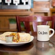 a burrito and a cup of coffee