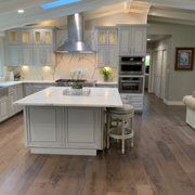 The hardwood flooring from Preverco adds a bit of rustic charm that makes this spacious kitchen feel even more inviting and welcoming.