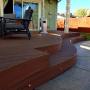 a patio with a table and chairs