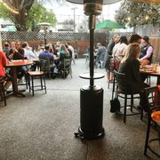 outdoor dining area with people sitting at tables