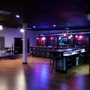 a dimly lit bar area