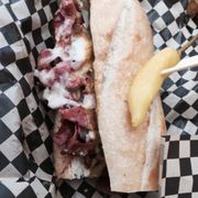 a sandwich with meat and cheese