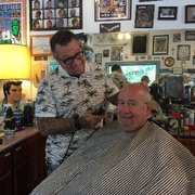 Getting my haircut by Tony the Barber