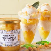 two ice cream sundaes with pineapple chunks