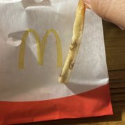 a hand holding a piece of food