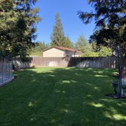 a backyard with a fenced in area