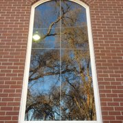 Large picture window installed into brick