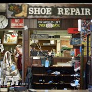 J&M boots and repair behind the counter