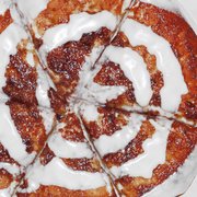 CinnaBread: Warm dessert pie smothered with brown sugar, cinnamon & icing. Add juicy apples, crispy bacon, or caramelized pecans