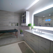 We custom fit this granite countertop to this ensuite bathroom along with installed mosaic and tile flooring.