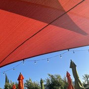 red umbrellas and string lights