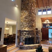Before picture: client no longer liked the heavy rock and wanted smooth plaster.