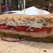 a sandwich with tomatoes and cheese