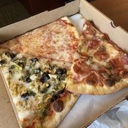 Cheese pizza slice, sausage and pepperoni slice, and veggie with olive, artichoke, garlic. I don't remember the names of the slices