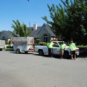 two men standing in front of a truck