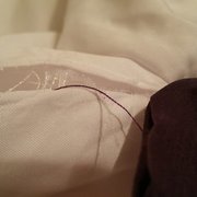 Where she removed the zipper, the seam is coming undone.