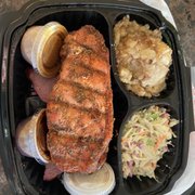 Porkchop, tri-tip(below PC), slaw, smoked potatoes, and side sauces