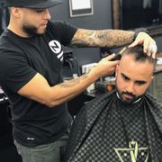 Daniel Solis & Eduardo Mata Co-owners of Danny's Barbershop taking care of each other, Family, their barbers, and the community.