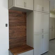 Cabinets with walnut ship lap accent wall