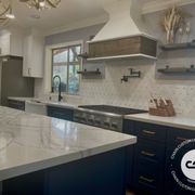 a kitchen with a marble countertop