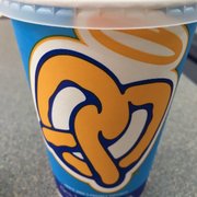 a plastic cup with a straw