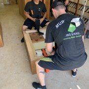Utilizing the shoulder harness to move big pieces.