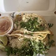 two tacos in a styrofoam container