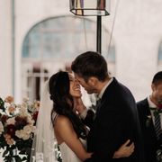 bride and groom's first wedding kiss