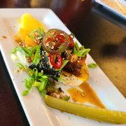 a plate of food with pickles
