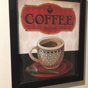 a cup of coffee and a spoon