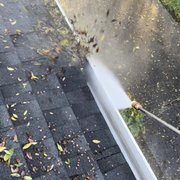 "In Progress" Photo cleaning out Gutter