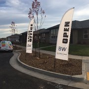 Custom Feather Banners printed, delivered and installed for another happy client!