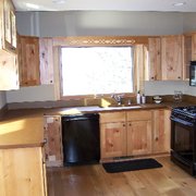 a kitchen with black appliances