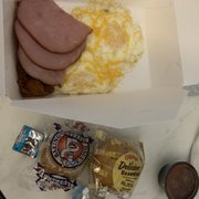 Fried eggs w/melted cheese, ham, and chorizo. Banana & blueberry muffins too :)