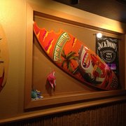 a surfboard mounted on the wall
