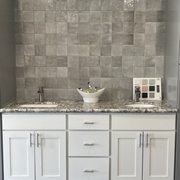 grey and white shaker cabinetry with a glacier white granite and a Cloe grey 4 x 4 tile backsplash.