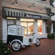an ice cream truck parked in front of a store