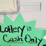 a sign that says lottery is cash only