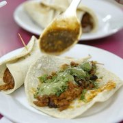 a plate of tacos and a cup of coffee