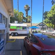 a food truck parked in front of a restaurant