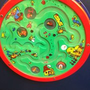 Spinning ladybug maze wall mounted game