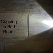 Cupping at seams in bedroom