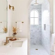 a bathroom with a marble shower