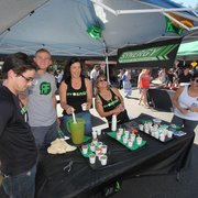 a group of people standing around a table