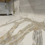 Qatari quartz with a Mokato shoji white subway tile.