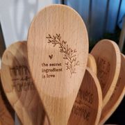 Woman-owned product lines like these engraved wooden spoons.
