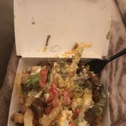 a box of food with a spoon in it
